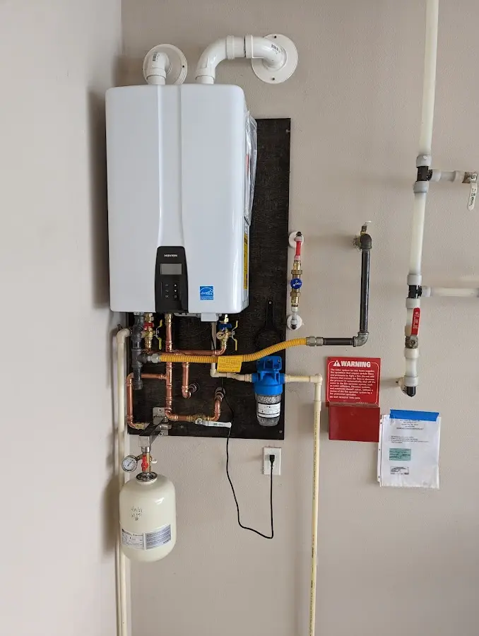 Professional plumber installing copper piping in a Walnut Park home